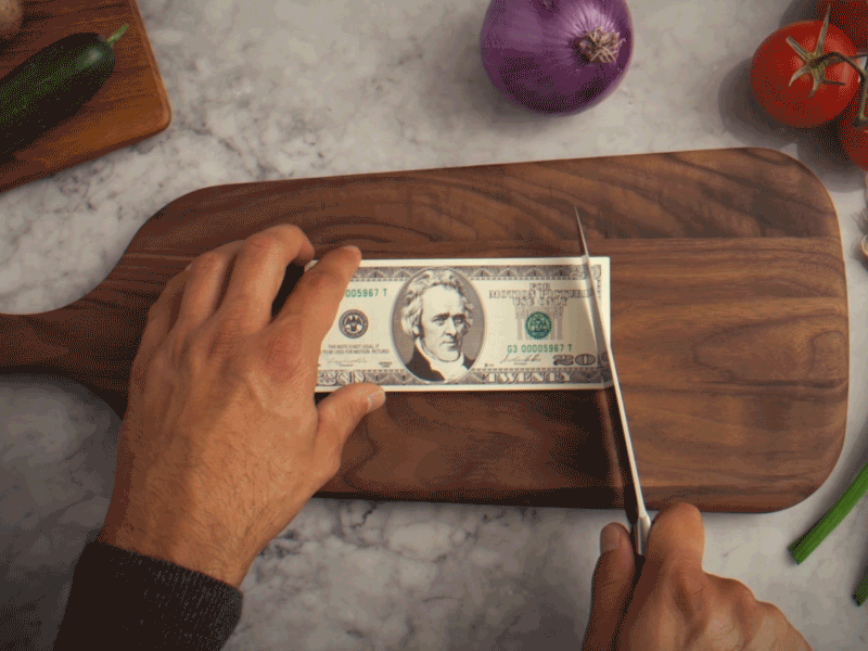 Animated gif of chopping up a twenty dollar bill